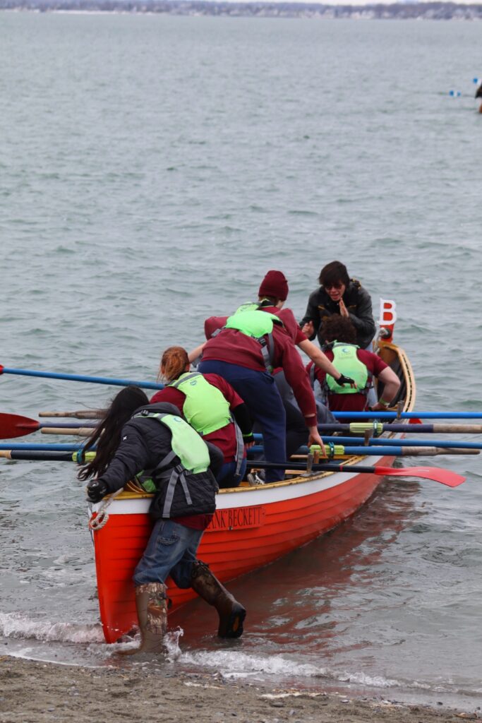 Mount Abraham Union High School Youth team rowing “Frank Beckett” at the start of the Snow Row.