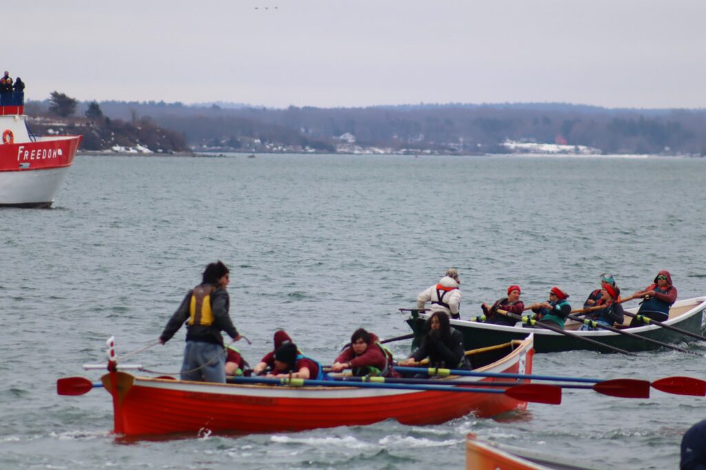 Mount Abraham Union High School Youth team rowing “Frank Beckett” at the start of the Snow Row.
